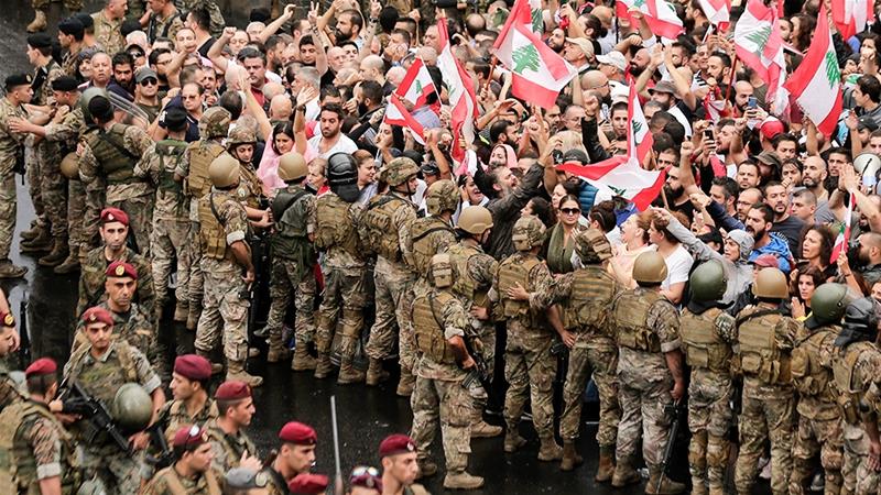 Lebanese army soldiers corral protesters in Beirut. (AP Photo)