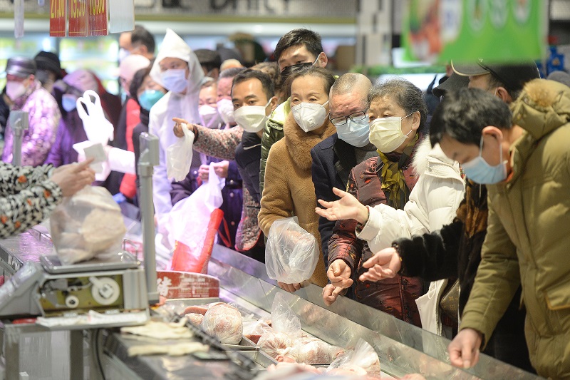 People wearing protective masks shop at a supermarket in Wuhan, the epicentre of the outbreak of a novel coronavirus, in China's central Hubei province. (AFP/file)