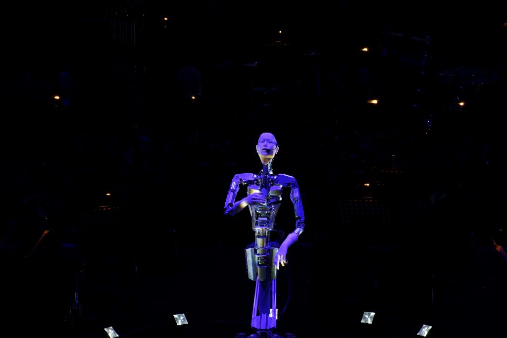 A robot with artificial intelligence performed alongside a human orchestra. (AN photo)