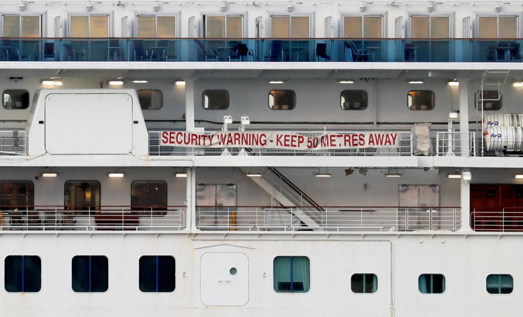 A banner is seen on the cruise ship Diamond Princess at Daikoku Pier Cruise Terminal in Yokohama, south of Tokyo. (Reuters)