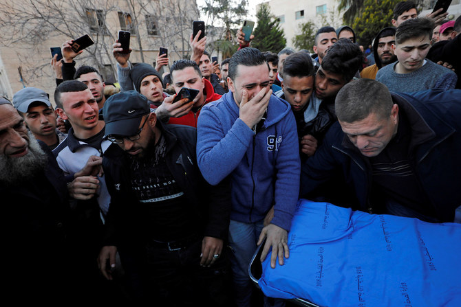 Relatives of 17-year-old Palestinian Mohammed Al-Hadad react at a hospital in Hebron in the Israeli-occupied West Bank Feb. 5, 2020. (Reuters)