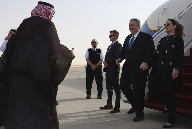 US Secretary of State Mike Pompeo (second right) and his wife Susan are met by a member of Saudi protocol as they arrive at the King Khalid International Airport in Riyadh, Wednesday, Feb. 19, 2020. (AP)