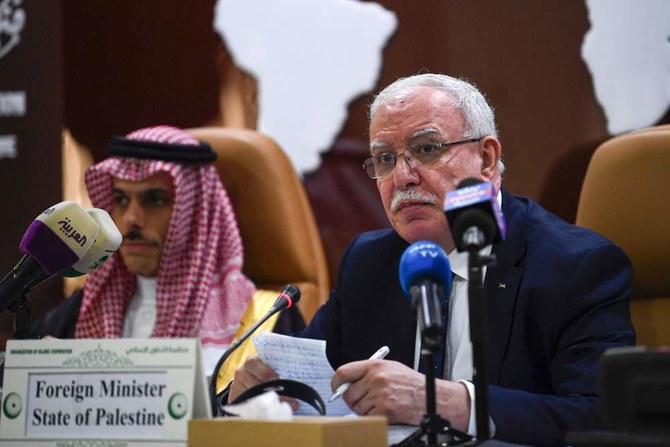 Palestinian Foreign Minister Riyad Al-Maliki (right) delivers a speech during an emergency ministerial meeting of the Organization of Islamic Cooperation (OIC) in Jeddah on Feb. 3, 2020, to address US President Donald Trump’s Middle East plan. (AFP)