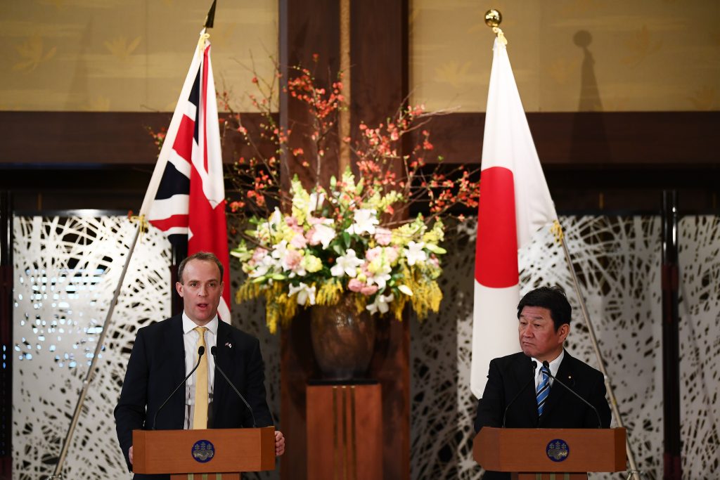 Britain's Foreign Secretary Dominic Raab (L), flanked by Japan's Foreign Minister Toshimitsu Motegi (R), delivers a speech during a joint press conference in Tokyo on Feb. 8, 2020. (AFP)
