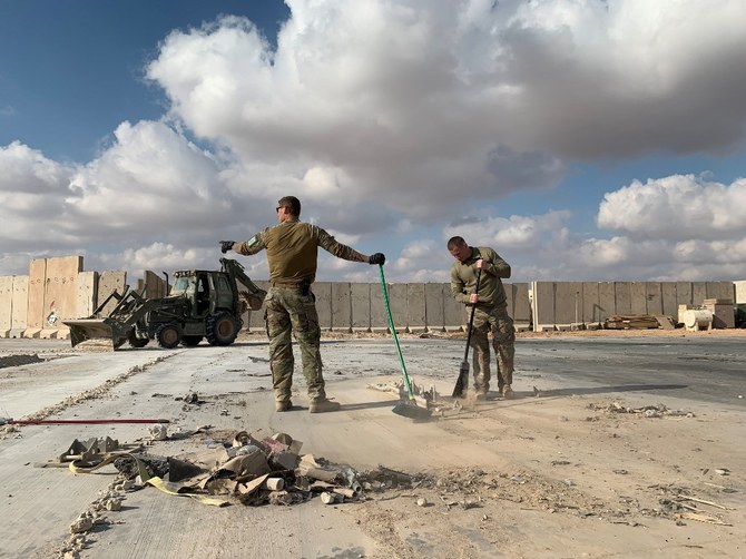 US soldiers clearing rubble at Ain Al-Asad military airbase in western Iraq that was hit by an Iranian missile strike last month. (AFP/File photo)