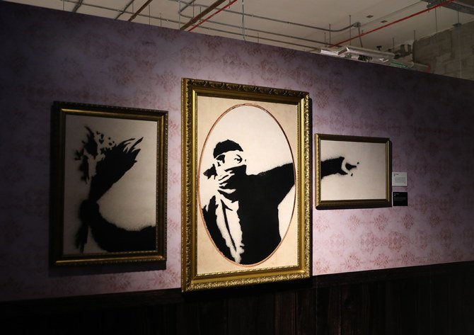 Some of British artist Banksy’s works on display at the King Abdullah Financial District (KAFD) in Riyadh starting Feb. 20, 2020. (AN photo by Saleh AlGhannam)