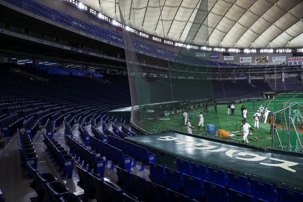 A Yomiuri Giants baseball player is seen during a practice session behind closed doors amid the spread of the new coronavirus, at the Tokyo Dome. (File photo/AP)