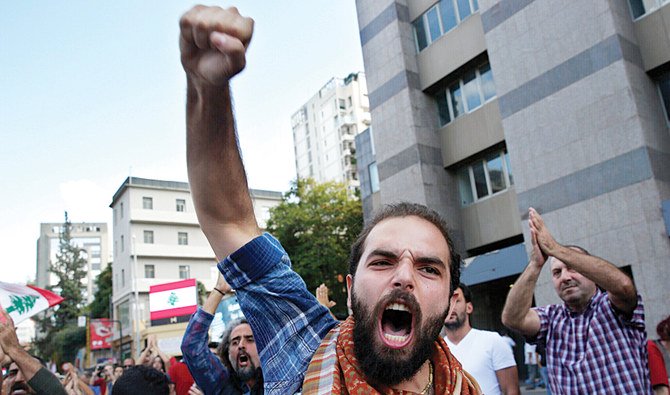 A protester shouts slogans during a rally to protest government policies, in Beirut. (AP)