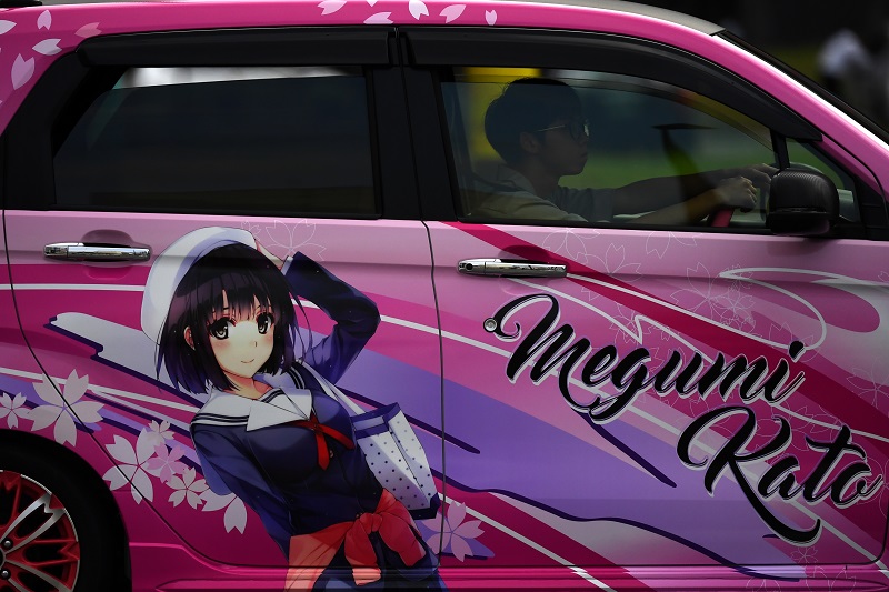 A woman drives her car decorated with Manga character Megumi Kato in Oita on October 7, 2019. (AFP/file)