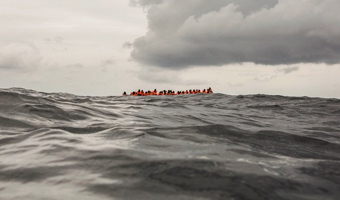 In this Sunday Feb. 18, 2018 photo, refugees and migrants wait to be rescued by aid workers of the Spanish NGO Proactiva Open Arms, after leaving Libya trying to reach European soil aboard an overcrowded rubber boat, 60 miles north of Al-Khums, Libya. (AP)
