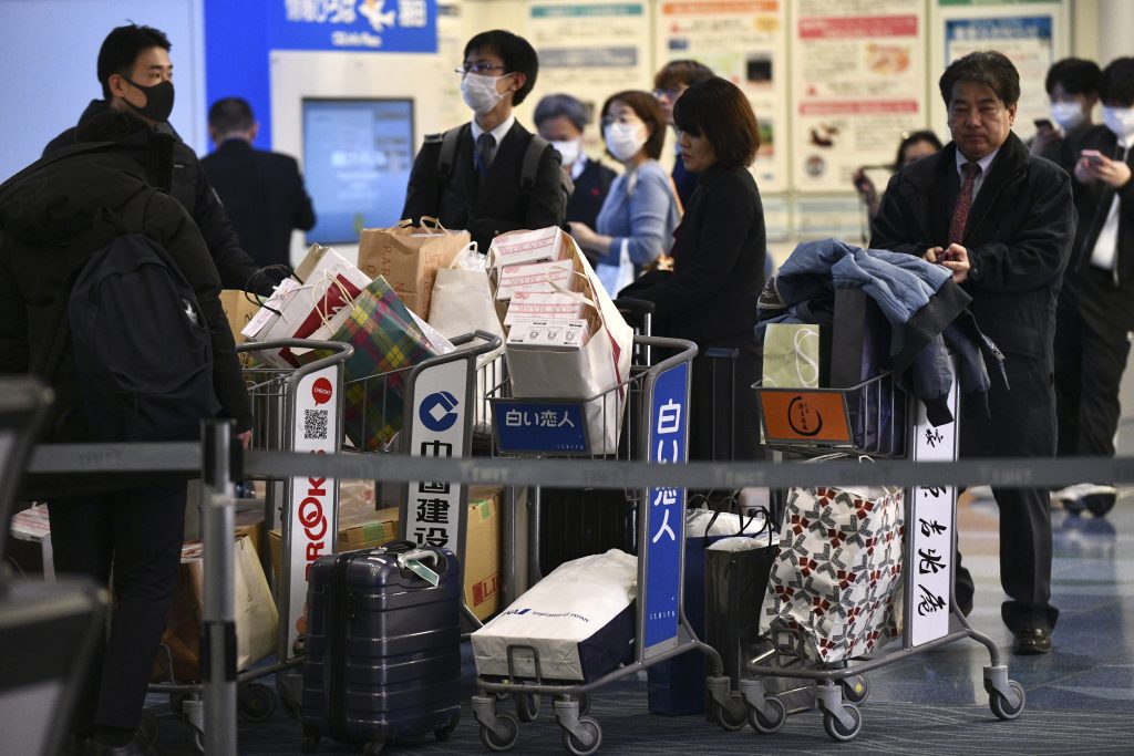 Ministry of Health, Labor and Welfare staff gather medical supplies before boarding to a government's charter plane to evacuate nationals from Wuhan, Jan. 28, 2020. (AFP)