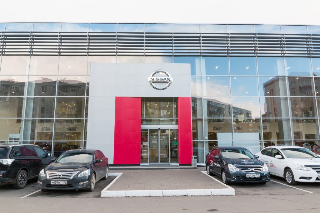 Showroom and car of dealership Nissan in Kirov city, Russia. (Shutterstock)