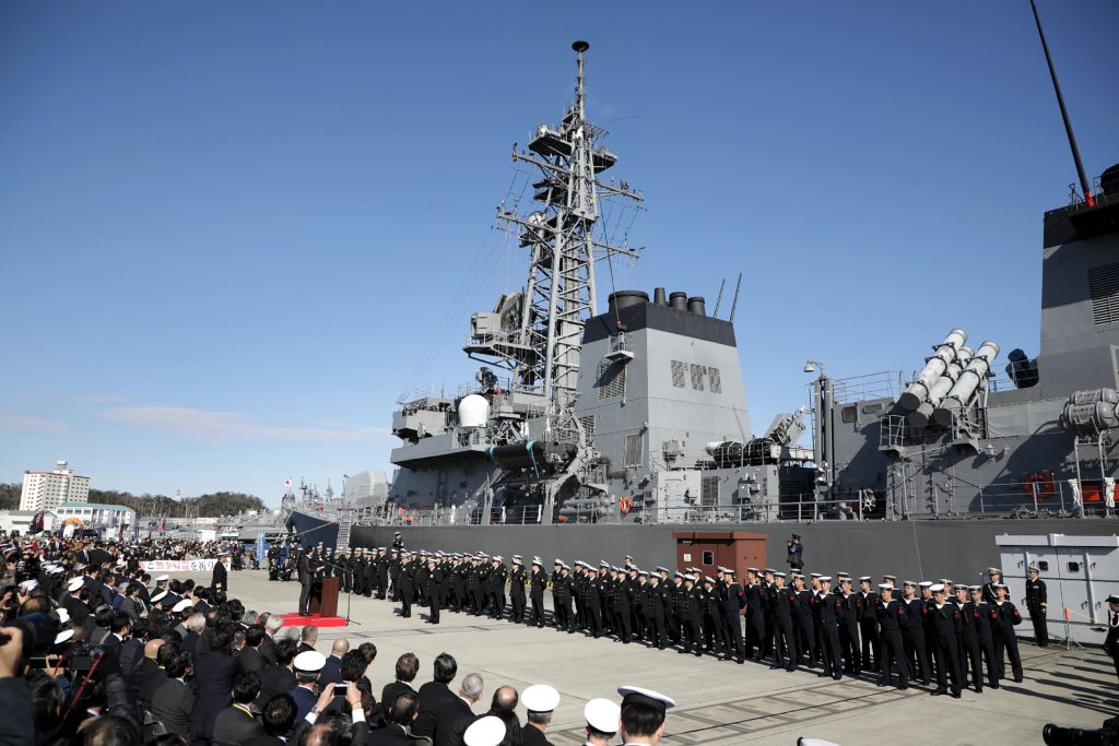 Japan's Prime Minister Shinzo Abe (centre L) speaks during a ceremony to mark the departure of Japan's Maritime Self-Defence Force destroyer 