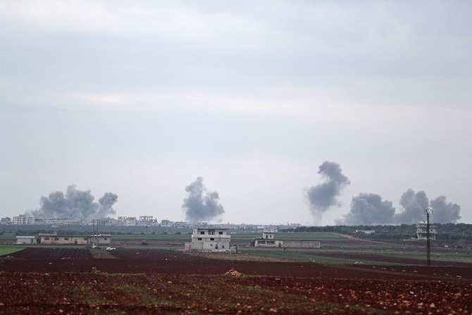 A picture taken from the town of Sarmin in northwestern Syria on Feb. 21, 2020 shows smoke billowing over the village of Qaminas, about 6 kilometers southeast of Idlib city, following reported Syrian air strikes. (AFP / Omar Haj Kadour)