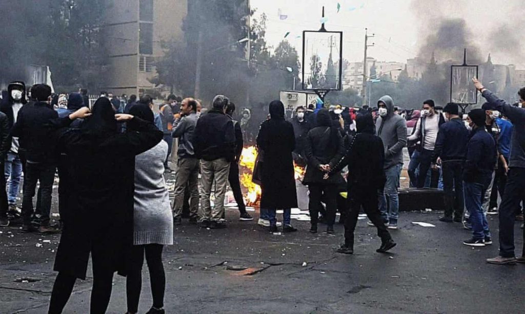 Protesters block a road in Tehran during demonstrations against fuel price rises. (Shutterstock)