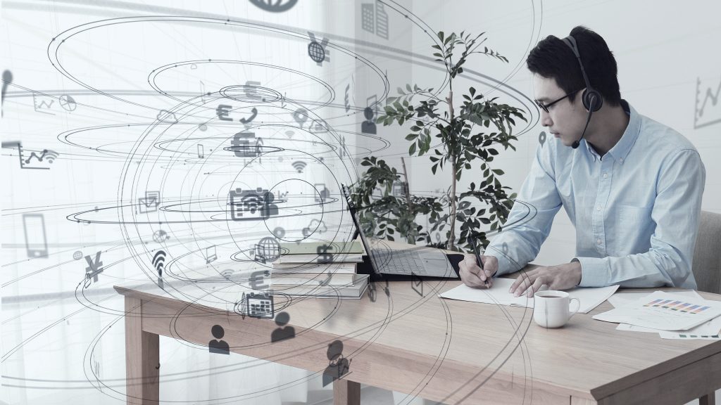 A man o his laptop working from home. (Shutterstock)