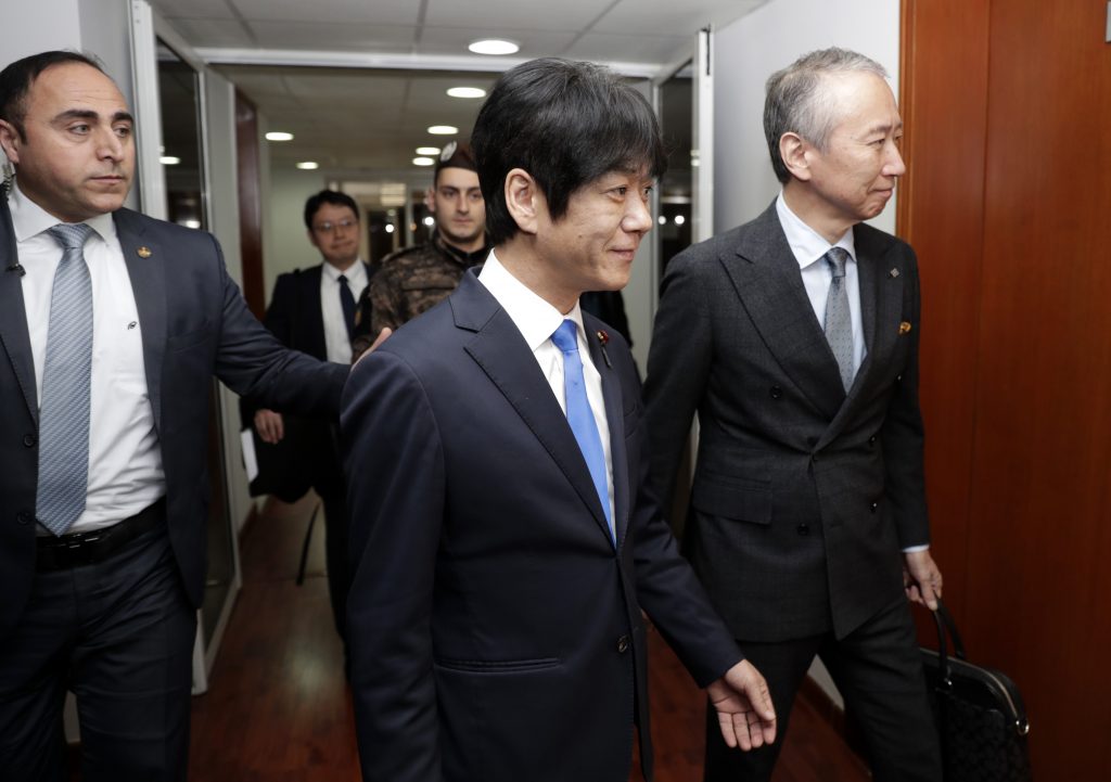Japan's deputy Justice Minister Hiroyuki Yoshiie (C) arrives to meet with Lebanese Justice Minister in the capital Beirut, on March 2, 2020, to discuss the case of former Nissan Chairman Carlos Ghosn, currently a fugitive in his native Lebanon. (AFP)
