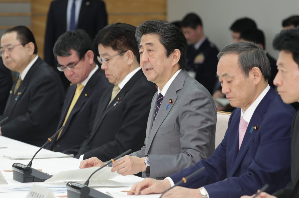 The meeting brought together Prime Minister Shinzo Abe, Chief Cabinet Secretary Yoshihide Suga and some other officials. (AFP)