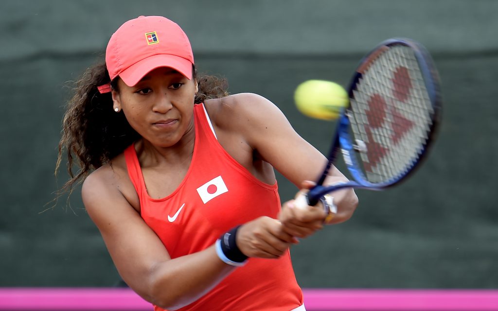 Japanese star Naomi Osaka says she's disappointed not to compete at the Tokyo Olympics this year but supports the decision to postpone the event to 2021. (AFP)