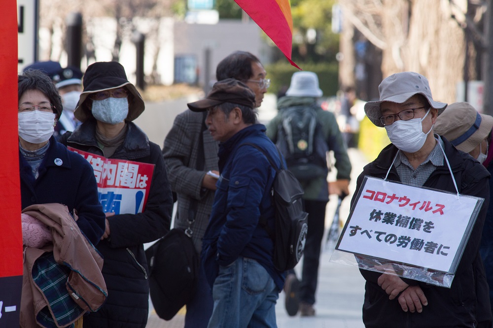 Protesters gather in front of the Japanese parliament, holding banners and shouting against the bill. (AN photo)