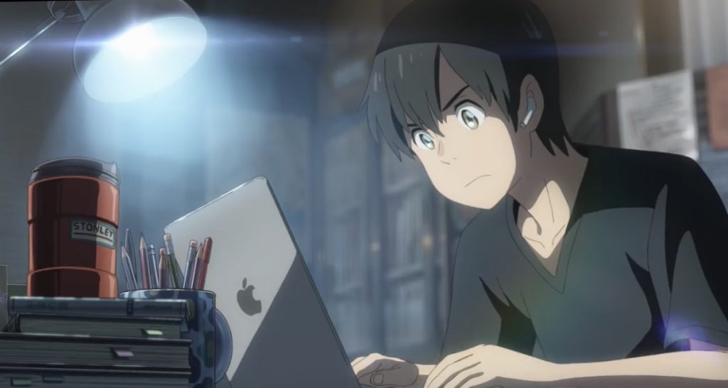 Anime characters behind a Macbook in Apple Japan’s 