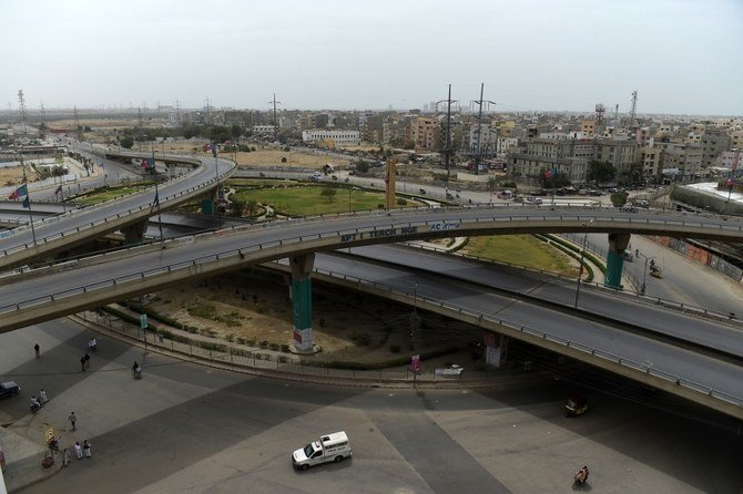 Commuters ride on deserted roads during a government-imposed nationwide lockdown as a preventive measure against the coronavirus in Karachi on March 25, 2020. (AFP)