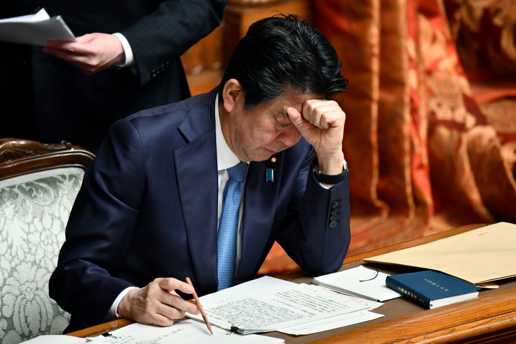 Japan's Prime Minister Shinzo Abe gestures as he attends a upper house plenary session at parliament in Tokyo, March. 6, 2020. (AFP)
