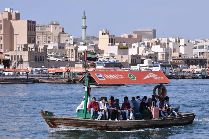 Passengers enjoy a traditional boat ride near Dubai's Deira Souk. (AFP / GIUSEPPE CACACE)