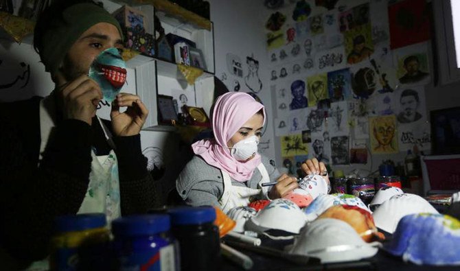 The idea of drawing on the masks came to the artists in Palestine because of the limited number of people who were wearing them in the Gaza Strip. (Supplied)
