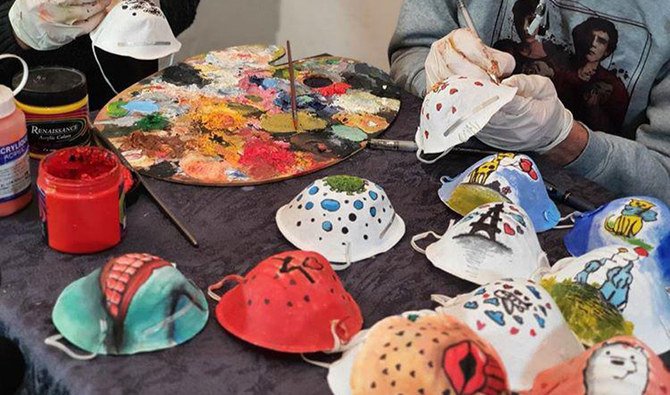 The idea of drawing on the masks came to the artists in Palestine because of the limited number of people who were wearing them in the Gaza Strip. (Supplied)