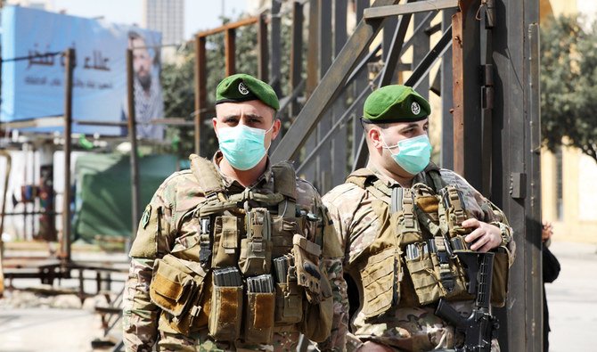Lebanese soldiers standing guard in the downtown district of the capital Beirut wear protective masks against the coronavirus Covid-19, on March 15, 2020. (AFP)