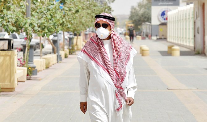 According to the WHO, people can catch COVID-19 from others who have the virus. The disease can spread from person to person through small droplets from the nose or mouth. (AFP/SPA)