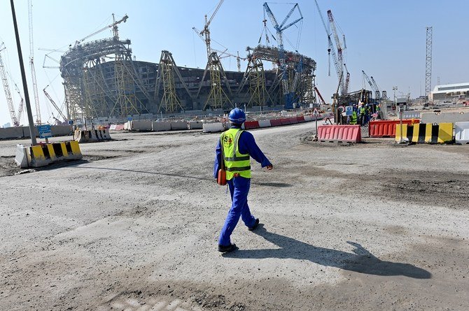 A picture taken on December 20, 2019 shows a construction worker at Qatar's Lusail Stadium, around 20 kilometres north of the capital Doha. (File/AFP)