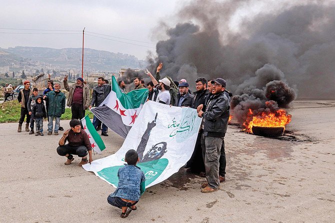 Civilians in Idlib cut off a section of the M4 highway, which links Aleppo and Latakia, protesting against the passage of Russian military patrols along the road. (AFP)