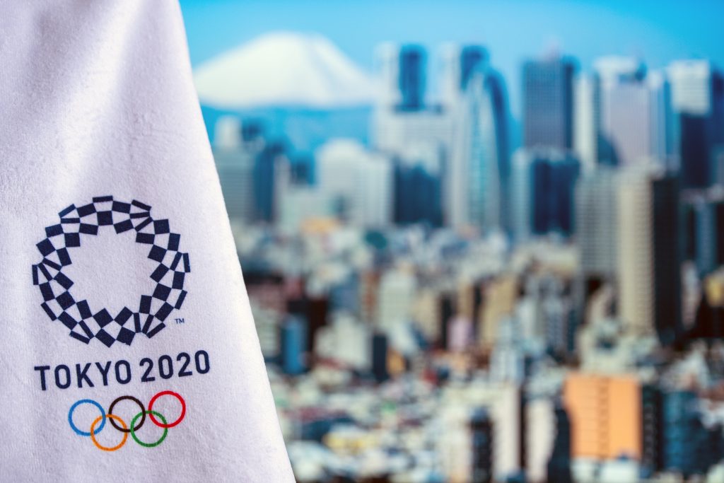 Tokyo city and official Logo of Tokyo 2020 Olympic Games. (Shutterstock)