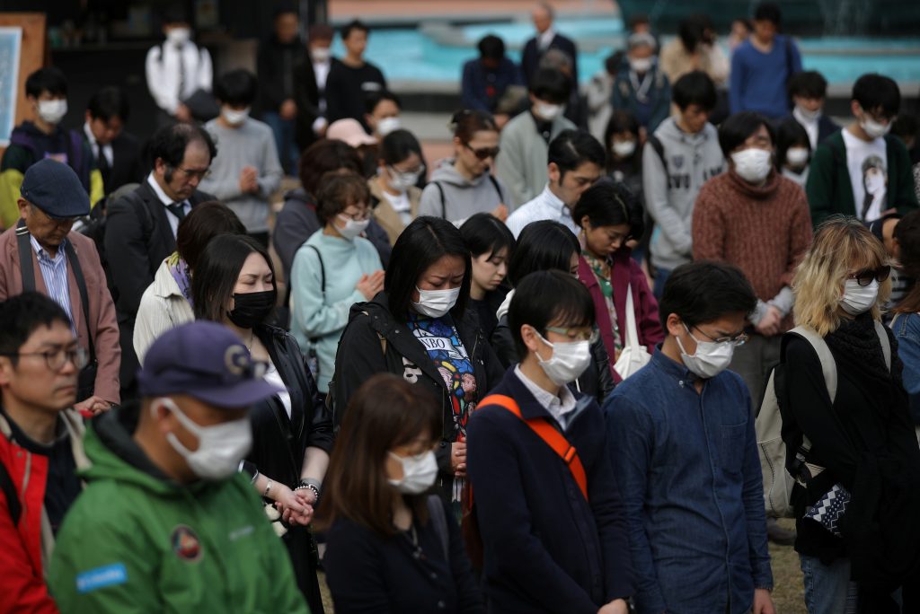People observe a moment of silence at 2:46 p.m. when a magnitude 9.0 earthquake struck off Japan's northeastern coast nine years ago, in Rikuzentakata, Iwate prefecture, northern Japan March. 11, 2020. (File photo/AP)