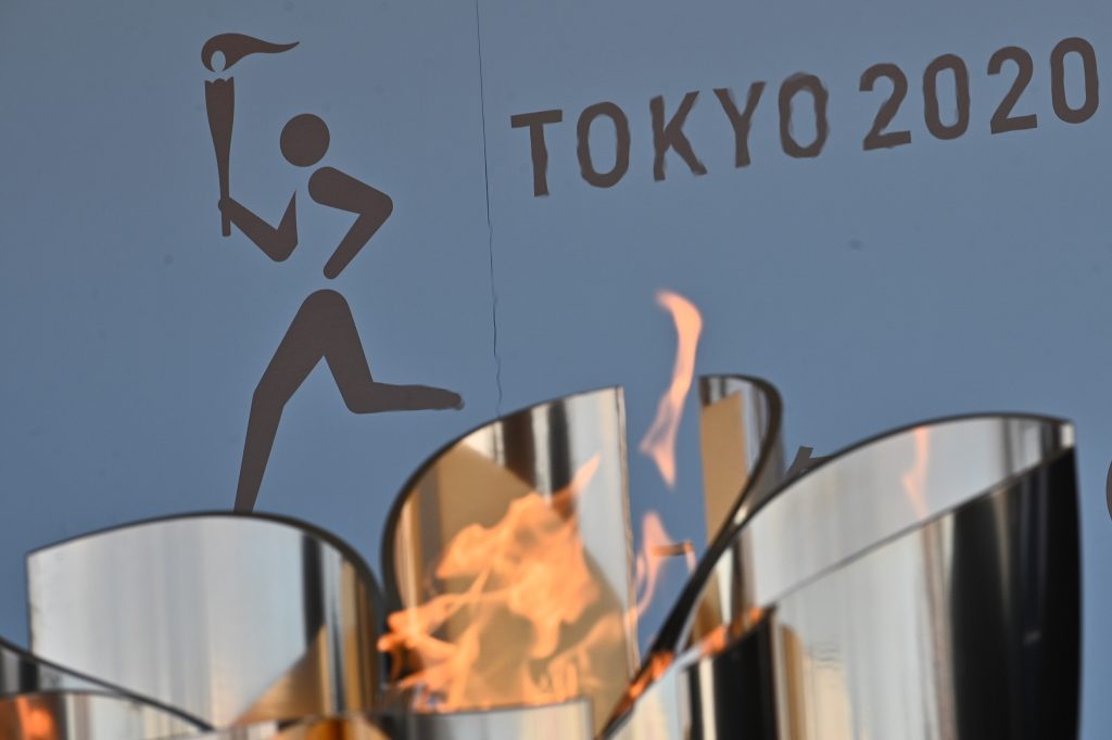 The logo for the Tokyo 2020 torch relay is pictured as the Olympic flame goes on display at the Aquamarine Fukushima aquarium in Iwaki in Fukushima prefecture on March 25, 2020. (AFP)