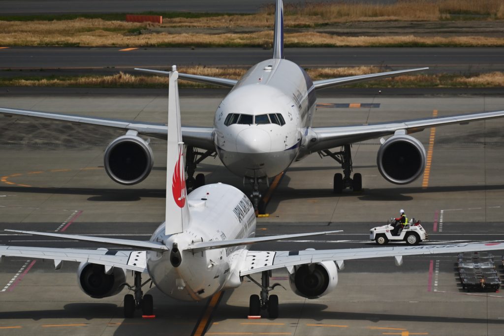 All Nippon Airways and Japan Airlines, or JAL, have announced that they will maintain drastic cuts in international flights in May. (AFP)