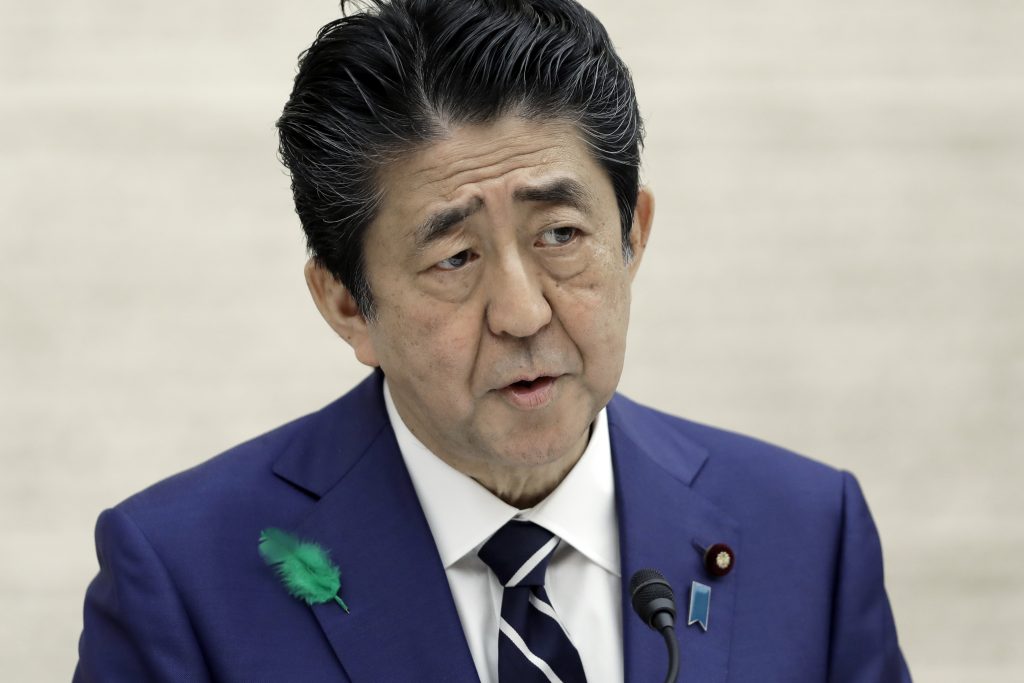 Abe urged the public to avoid traveling to rural areas, including family trips. (AFP)