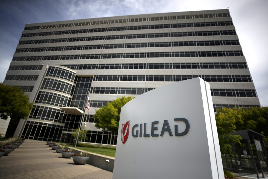 A sign is posted in front of the Gilead Sciences headquarters on April 29, 2020 in Foster City, California. Gilead Sciences announced preliminary results of a drug trial with that showed at least 50% of patients with coronavirus that treated with a five-day dosage of remdesivir improved and more than half were released from the hospital within two weeks. (AFP)