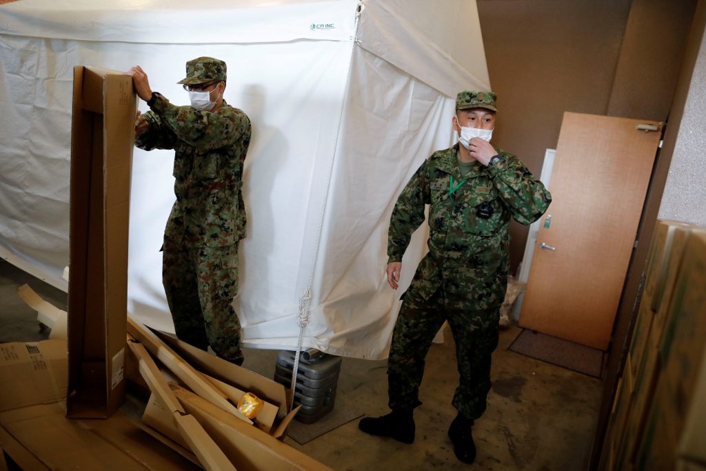 Japanese Self-Defence Forces soldiers work at a hotel that has been designated to accommodate asymptomatic people and those with light symptoms of the coronavirus disease (COVID-19) to free up hospital beds, in Tokyo, Japan April 7, 2020. (REUTERS)