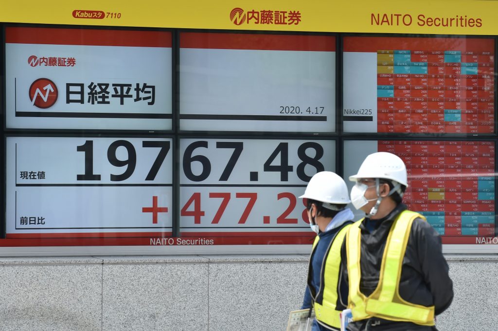 Tokyo's benchmark Nikkei index rallied more than 3.1 percent on April 17 as investors welcomed a pledge by President Donald Trump to press ahead with reopening the US economy. (File photo/AFP)