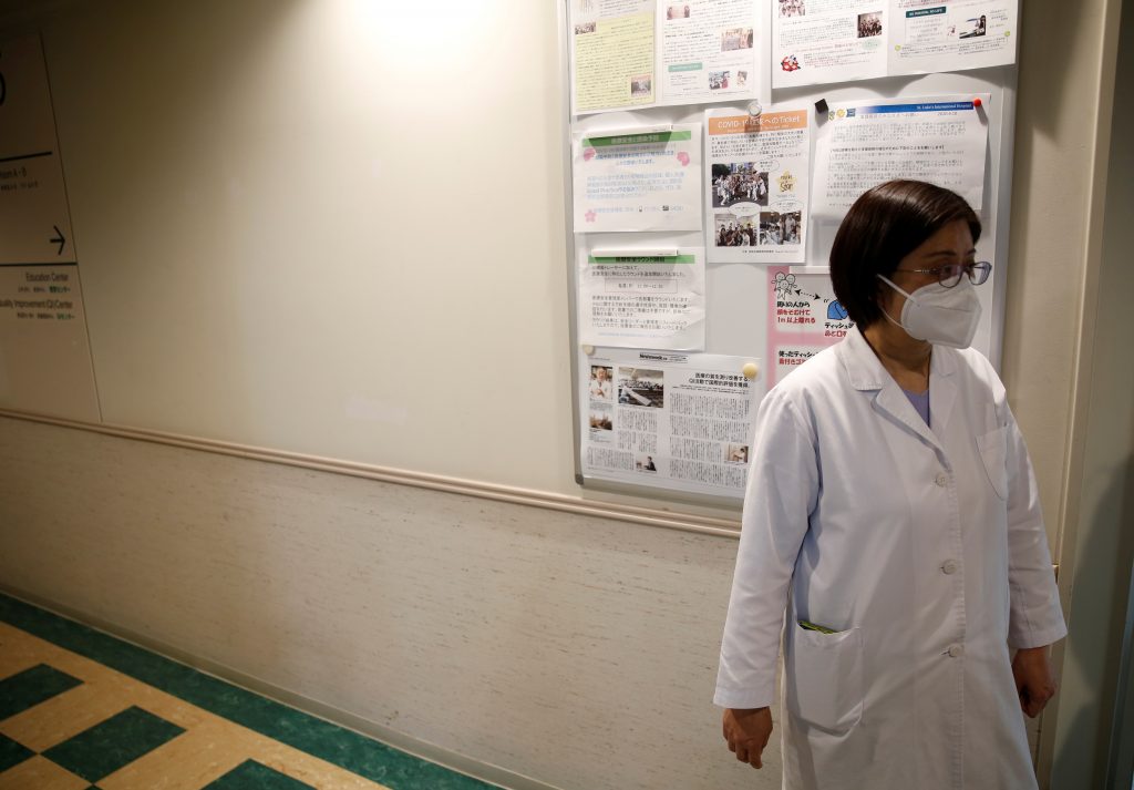 Fumie Sakamoto, a nurse of St. Luke's International Hospital, stands in front of her office as she talks to Reuters reporters in Tokyo, Japan, Apri.l 21, 2020. (File photo/Reuters)