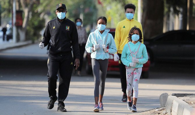 A family takes a walk in the upscale neighborhood of Zamalek, as Egypt ramps up efforts to slow the spread of the coronavirus disease (COVID-19) in Cairo. (Reuters)