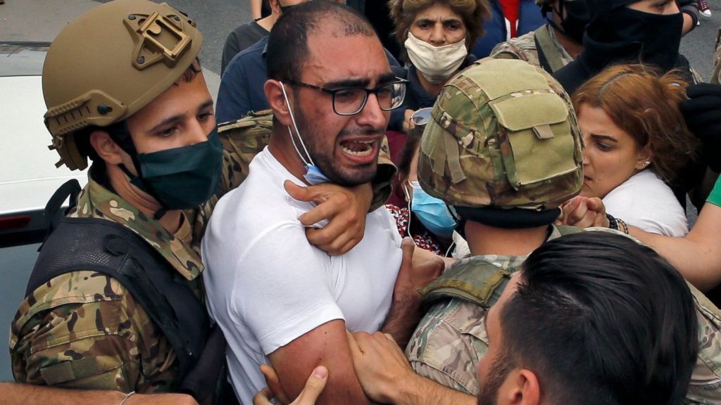 Anti-government protesters scuffle with Lebanese army soldiers in the town of Zouk Mosbeh, north of Beirut, Lebanon, April 27, 2020. (AP Photo)