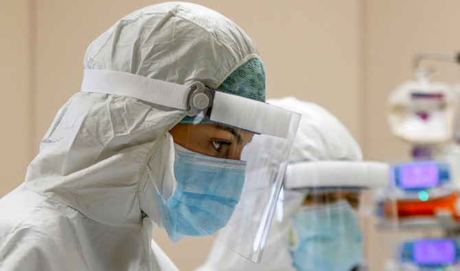 Medical staff work in the ICU of the Covid 3 hospital in Casalpalocco, near Rome, Saturday, April 11, 2020. (AP)