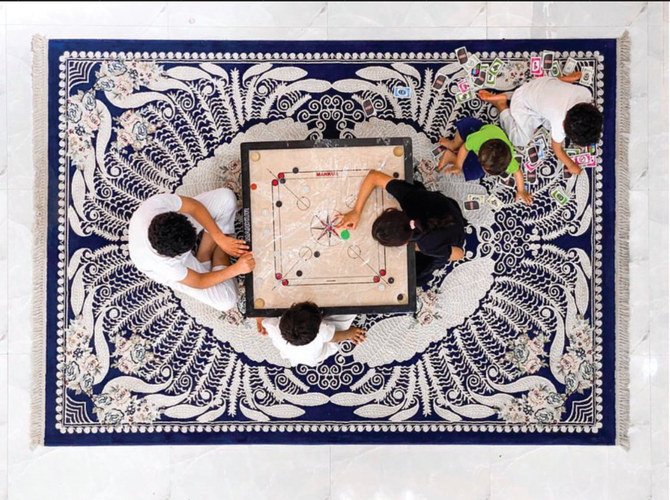 For many Saudi families, there is no better way to stay entertained than by playing a board game that both old and young enjoy. (Photo by Nouf Al-Qassimi @Noufaty)