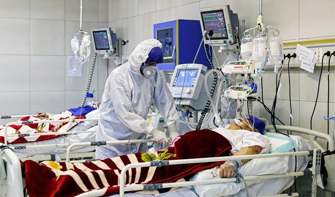 In this March 1, 2020 file photo, a medic treats a patient infected with coronavirus, at a hospital in Tehran, Iran. (AP)