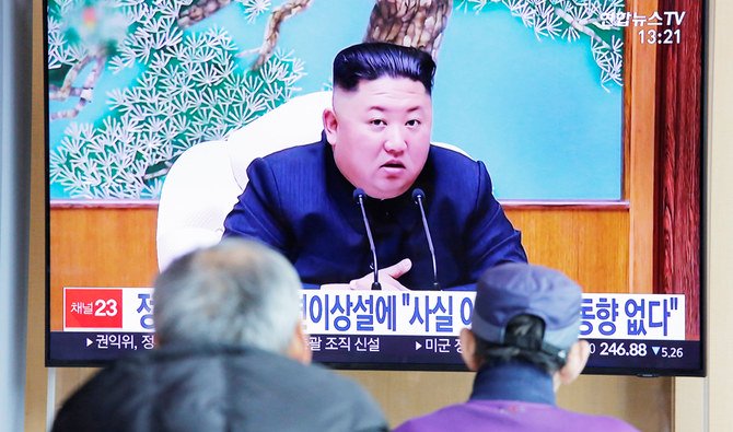 South Korean people watch TV broadcasting a news report on North Korean leader Kim Jong Un in Seoul on Tuesday. (Reuter)