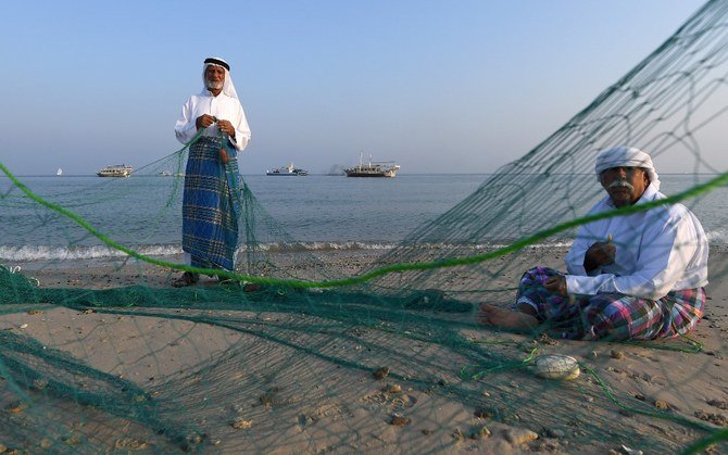 Above, Emirati fishermen set up nets on the shore of Dalma Island, about 40 kilometers off Abu Dhabi this October 21, 2019 file photo. A fund is helping families in dire need of support amid the coronavirus pandemic. (AFP)